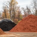 Multiple piles of various mulches