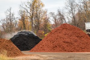 Multiple piles of various mulches