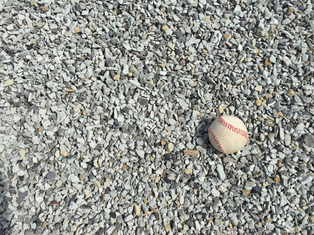 Light gray colored limestone with a white baseball for scale