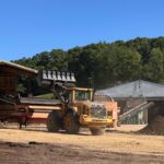a loader maching loading dirt